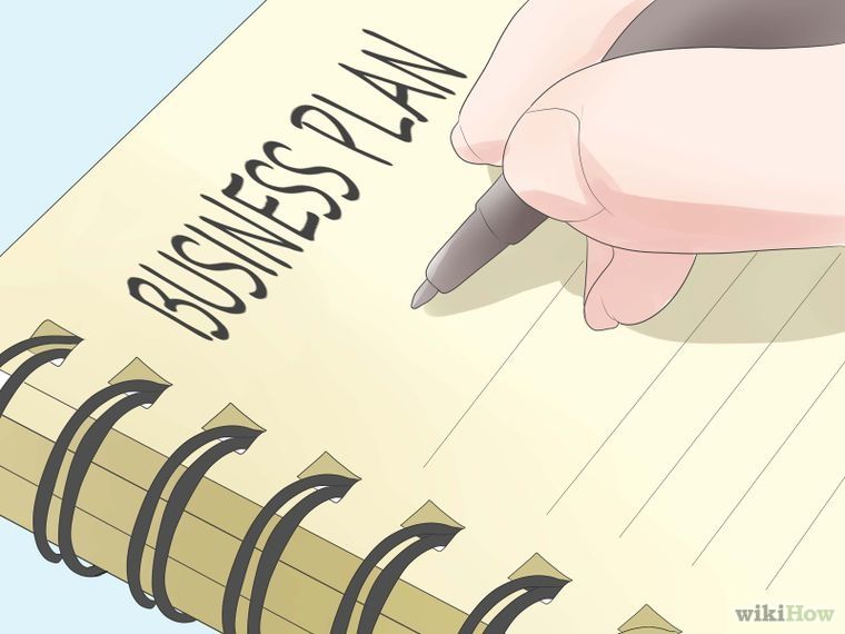 A hand writes “Business Plan” on a notebook, symbolizing business planning and strategy development.