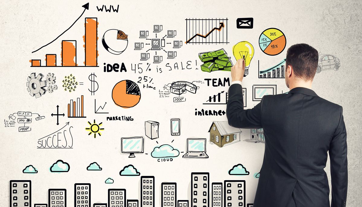 A businessman in a suit drawing business strategy illustrations on a wall filled with charts, graphs, financial symbols, and growth ideas, representing planning, marketing, and business growth concepts.