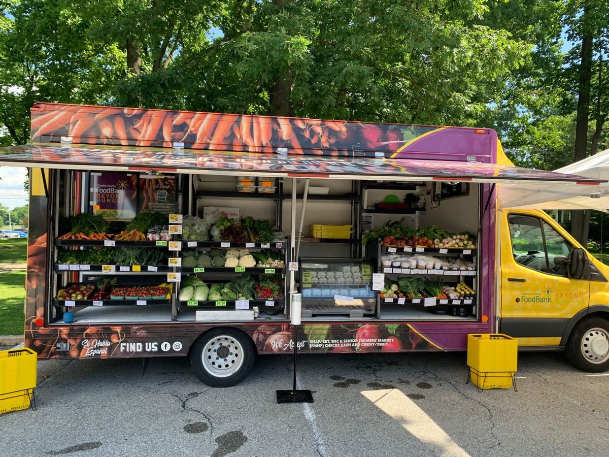 Fresh produce food truck serving customers, representing merchant cash advances for food trucks needing fast working capital without traditional bank loans
