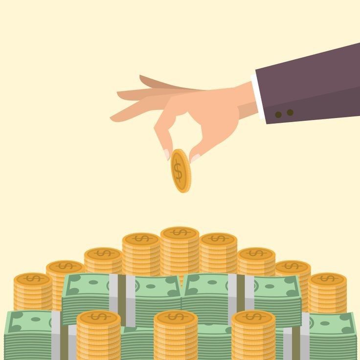 Hand dropping a coin onto stacks of gold coins and bundles of cash, showing saving, investment, or financial growth concept.