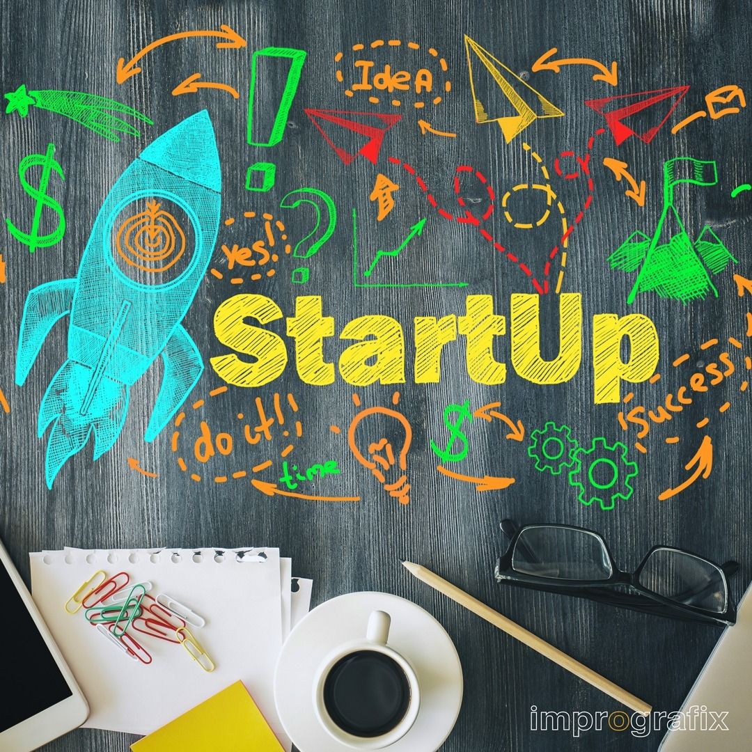 Colorful startup concept illustration with a rocket, charts, and business icons on a chalkboard above a workspace with coffee, papers, and glasses, representing merchant cash advances for startups to support business growth and funding.