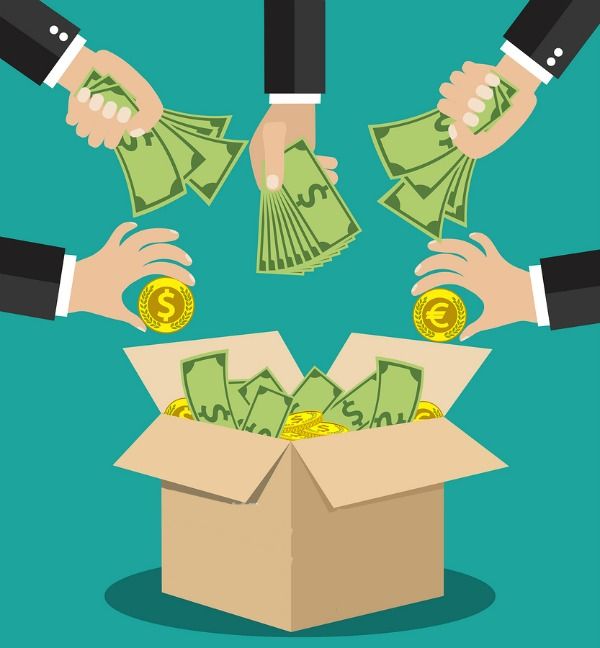 Business professionals placing cash and gold coins into open box symbolizing business funding, investment partnership, crowdfunding, and financial growth.